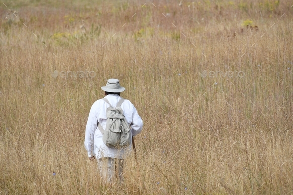 Active senior citizen Baby Boomer hiking a trail in the Flatiron region of Colorado