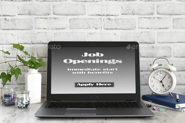Job Openings with benefits Apply Here - Online Job Search on laptop computer screen bright desk