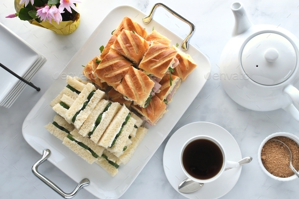 Afternoon tea sandwiches for party, baby or bridal shower. Cucumber cream cheese, ham arugula teapot