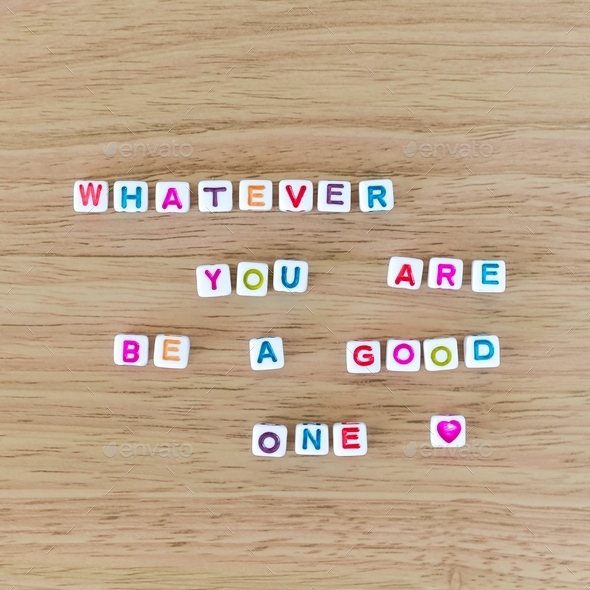 Quote “Whatever you are, be a good one” made out of beads, top view