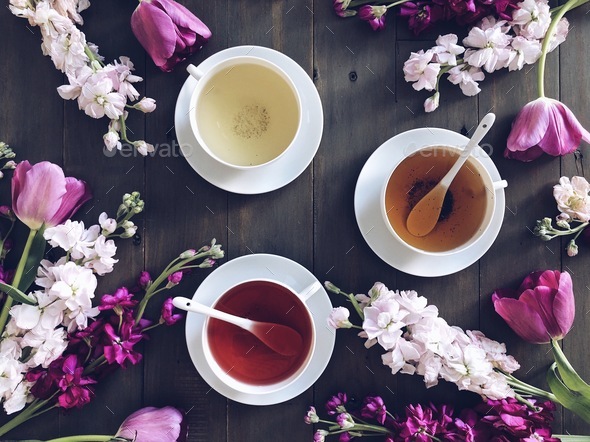 Overhead shot of three types of tea, green tea, black tea and fruit tea ...