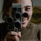 Mujer con cámara 8mm antigua  - PhotoDune Item for Sale