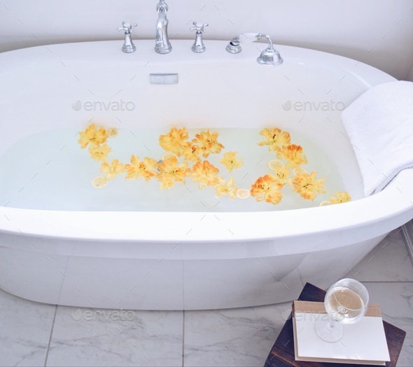 Bathtub filled with flower petals Stock Photo by JulieAlexK PhotoDune