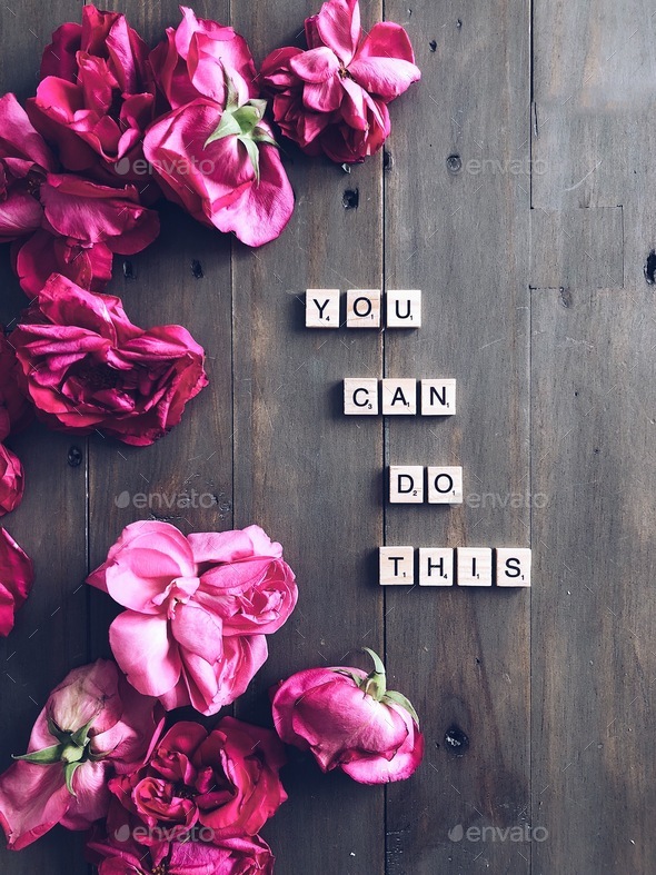 YOU CAN DO THIS. Motivational phrase with scrabble letters surrounded by bright pink roses