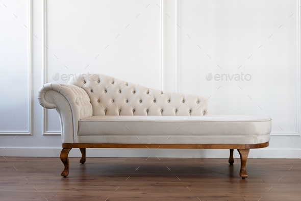 Beige light velour couch , Baroque sofa in a modern interior.