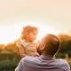 Daddy holding daughter on the hands in golden hour  - PhotoDune Item for Sale