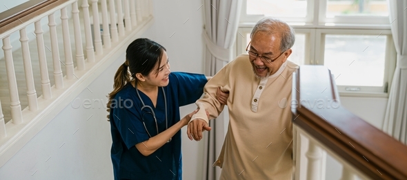 Nurse helping the elderly walk up the stairs