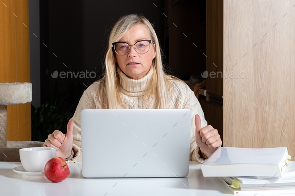 emotional freelancer surprised staring at laptop screen shocked by email received, work from home