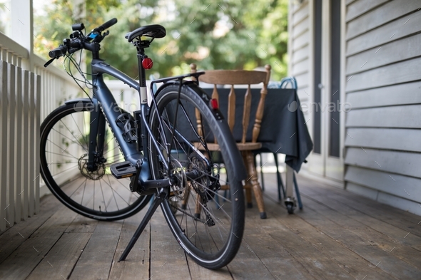 Ebike on porch of house - Stock Photo - Images