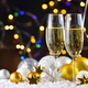 Two champagne glasses and christmas decorations on snow - PhotoDune Item for Sale