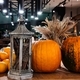 view of an old lantern pumpkin oranges standing in the composition at the entrance to the restaurant - PhotoDune Item for Sale