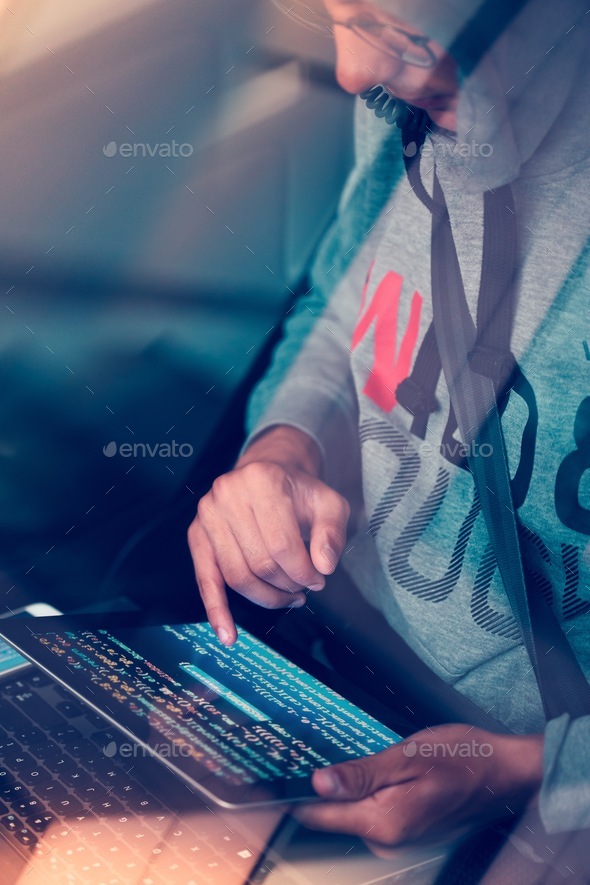 Hacker using computer, smartphone and coding to steal password. Password and private data - Stock Photo - Images
