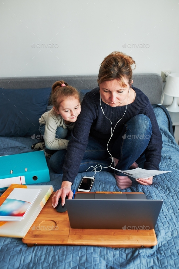 Woman mother working doing her job remotely during video chat call online course from home
