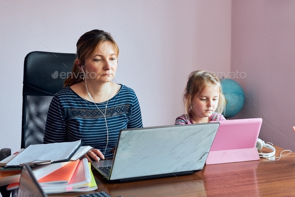 Woman mother working doing her job remotely during video chat call stream online course