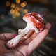 Amanita muscaria made of cotton wool in his hands on blurred background. r - PhotoDune Item for Sale
