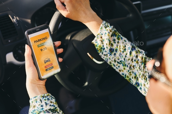 Paying for parking using payment app on smartphone. Pay online. Using technology. Car parking app