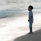 silhouette of a boy by the sea - PhotoDune Item for Sale
