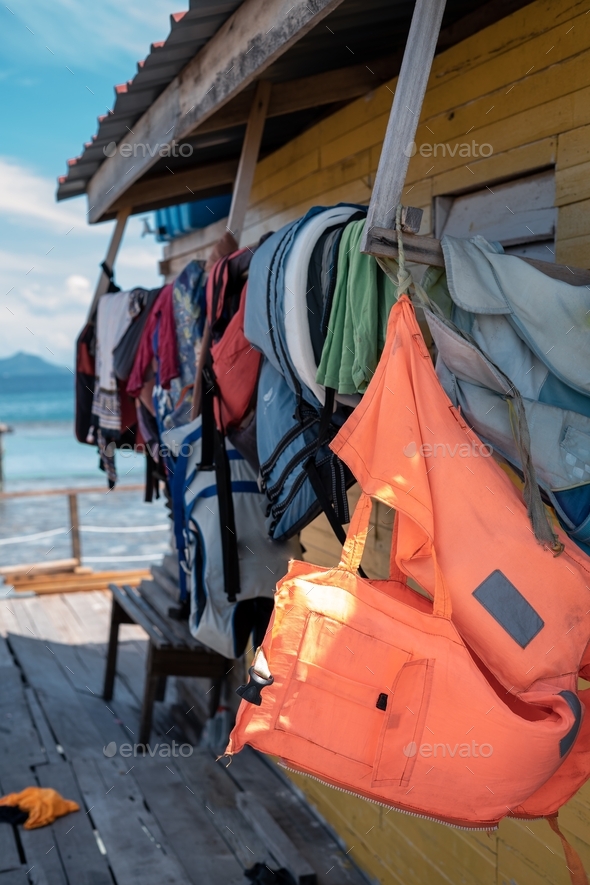 wet life jackets hanging on the resort