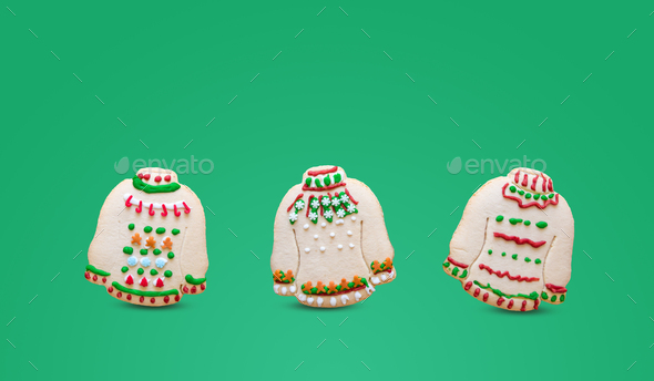 Ugly sweater Christmas cookies on green background