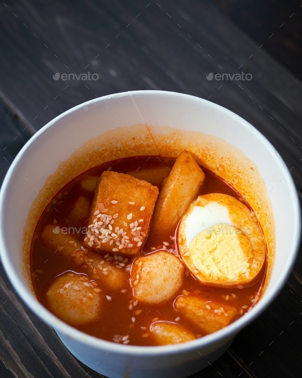  Stir-fried Rice Cake Tteok-bokki in a takeaway container. Korean food delivery.