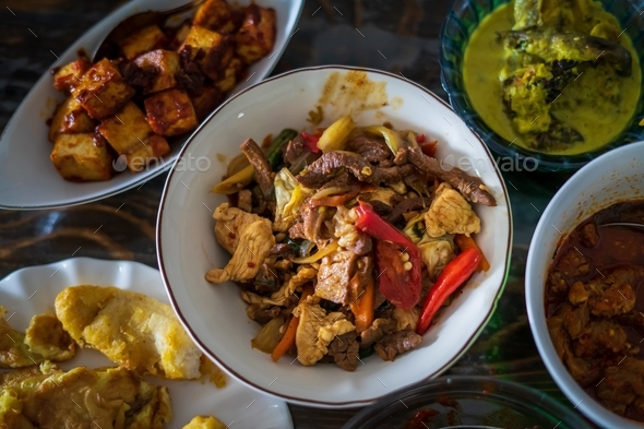 Assorted Malay dishes are served on the table. Staple menu for lunch ...