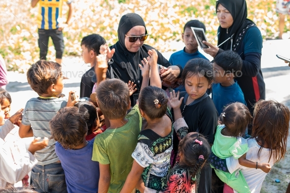 Sea gypsies children greetings the volunteers coming to their village ...