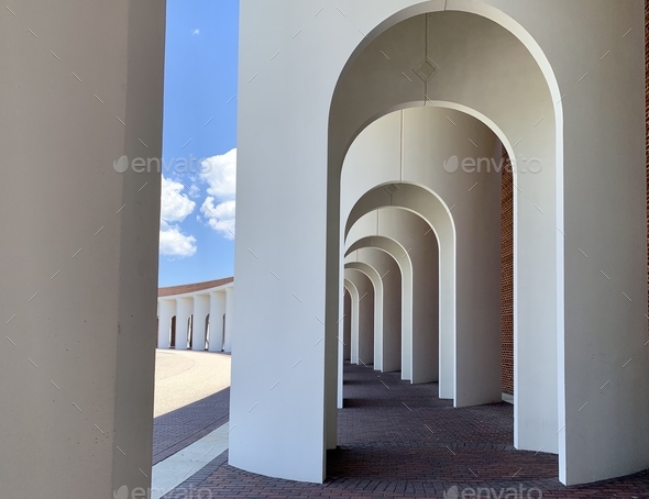 Modern architecture with patterned arches depth of field and sky view  - Stock Photo - Images