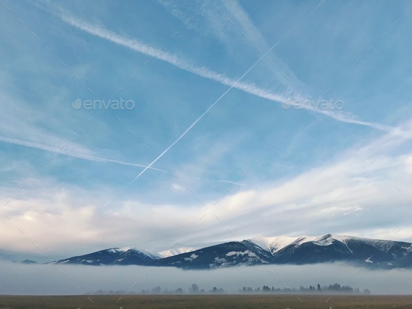 Blue sky, fog and mountains, cloudy day, clouds, foggy mountains, airplain - Stock Photo - Images