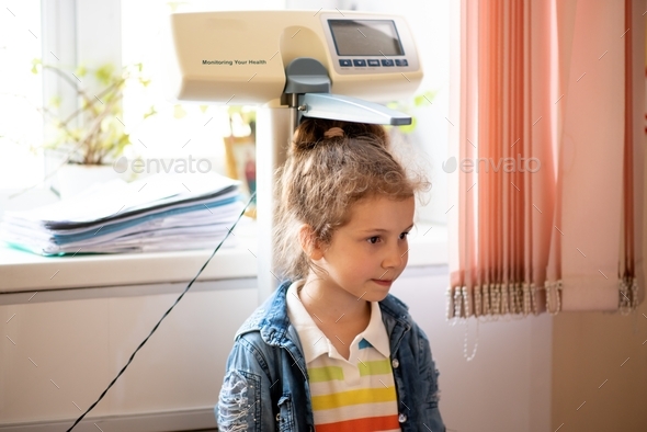 A little girl at a doctor\'s appointment.