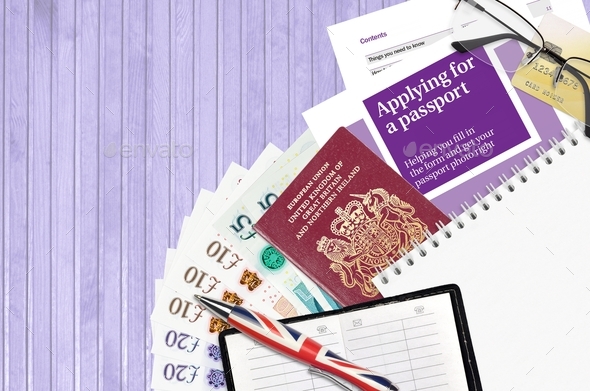 English violet guide Applying for a passport lies on table with office items
