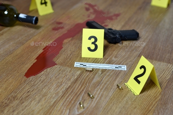 Murder concept - gun with blood and wine bottle on wooden floor close up
