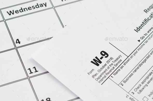 IRS Form W-9 Request for taxpayer identification number and certification blank lies on empty - Stock Photo - Images
