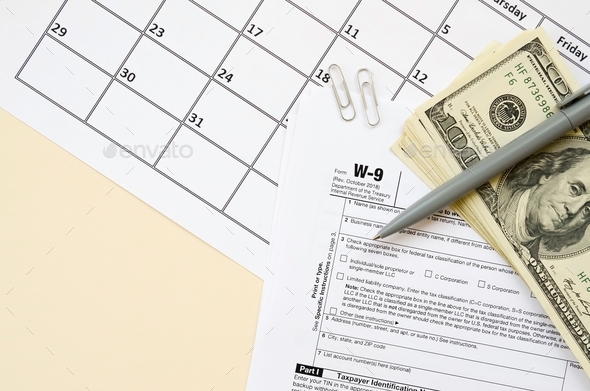 IRS Form W-9 Request for taxpayer identification number and certification blank lies with pen and - Stock Photo - Images