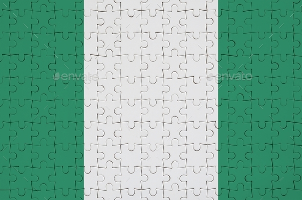 Nigeria flag  is depicted on a folded puzzle - Stock Photo - Images