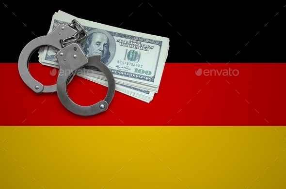 Germany flag with handcuffs and a bundle of dollars