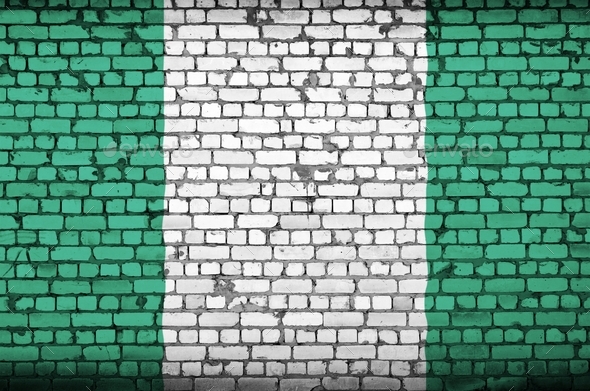 Nigeria flag is painted onto an old brick wall - Stock Photo - Images