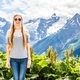 Young blonde woman in sunglasses on the background of mountains - PhotoDune Item for Sale