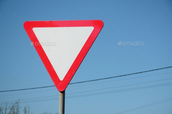 Traffic sign in the form of a white triangle. Give way  - Stock Photo - Images