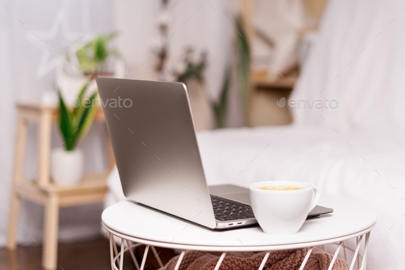 Distance learning online education and work. coffee cup t laptop, home