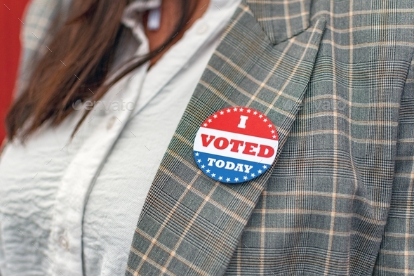 I voted today sticker on woman\'s jacket