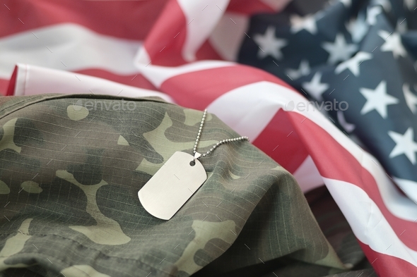 Silvery military beads with dog tag on United States fabric flag