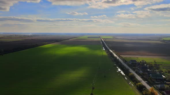 Field Panorama with Agricultural and Rural House Village Countryside with an Autumn Sky alt