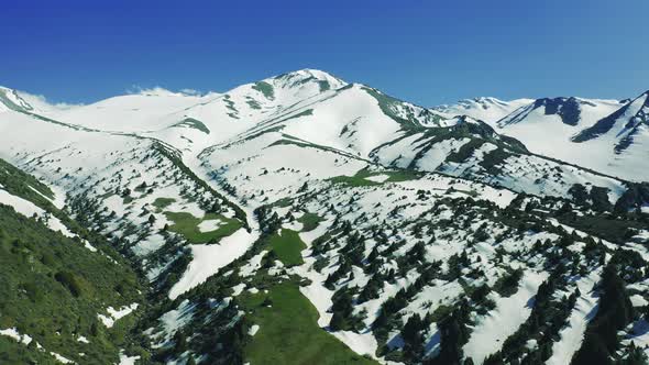 View of Alps Mountains with Snow and Dam Under High Mountain Pasture in Almaty Kazakhstan alt