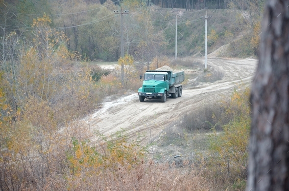 Dump truck transports sand and other minerals in the mining quar