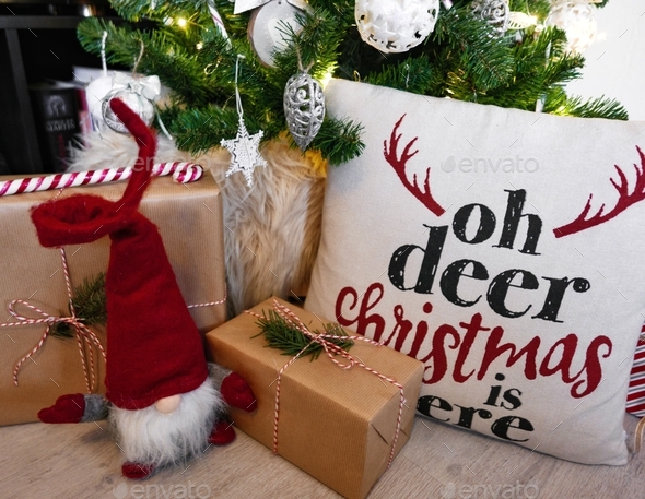 Close-up photo of christmas presents and decorations under christmas