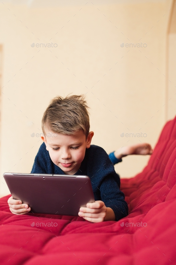 Child using tablet Stock Photo by shapoval08 PhotoDune