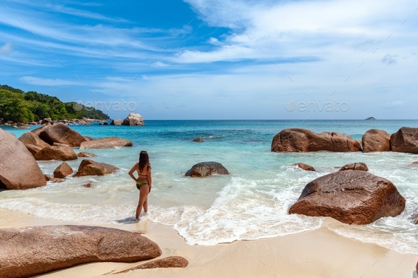 Young Lady In Bikini Standing On Sand Rocks Stock Photo, Picture