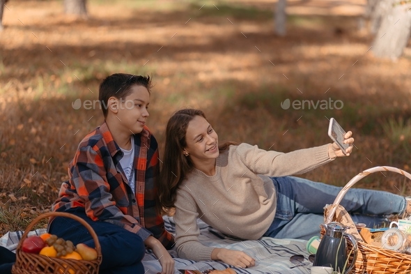 Teenagers On A Picnic In Autumn In Nature In The Forest Stock Photo By   Dd406de7 04d1 450a Bc1b D56b16c7140b 