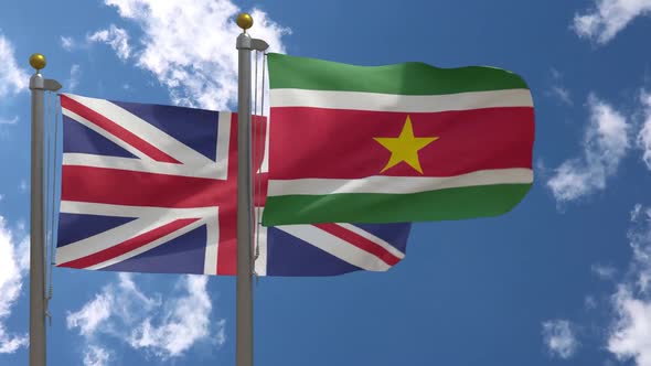 United Kingdom Flag Vs Suriname Flag On Flagpole alt