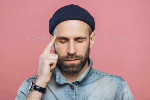 Headshot Of Serious Thoughtful Middle Aged Man Tries To Remember